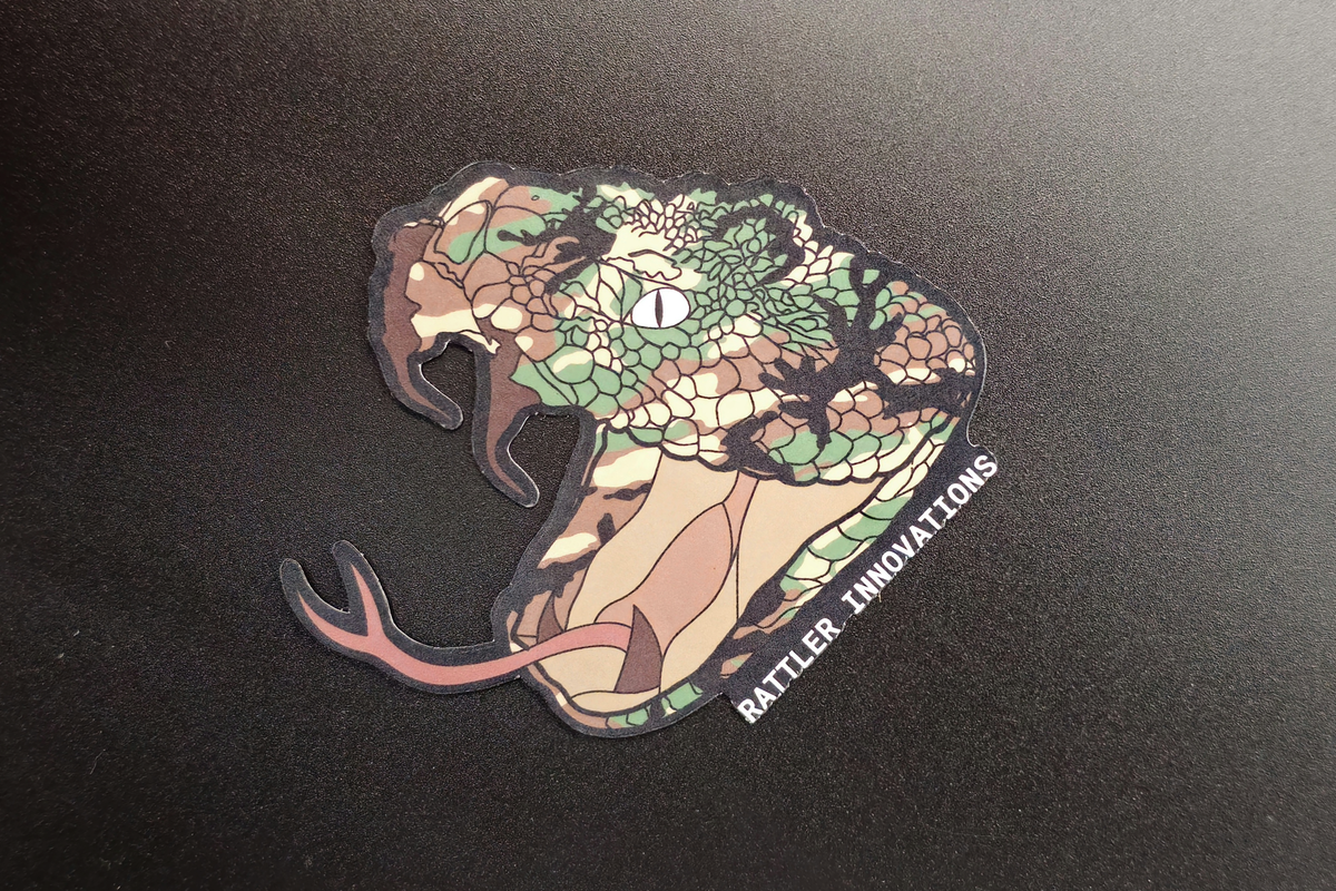 Cartoon Rattler Ridge Logo Rattler Innovations M81 Woodland Logo Sticker – Rattler Innovations LLC